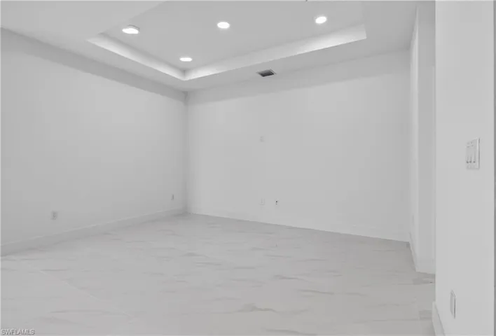 Recessed ceiling with integrated lighting, offering a contemporary aesthetic