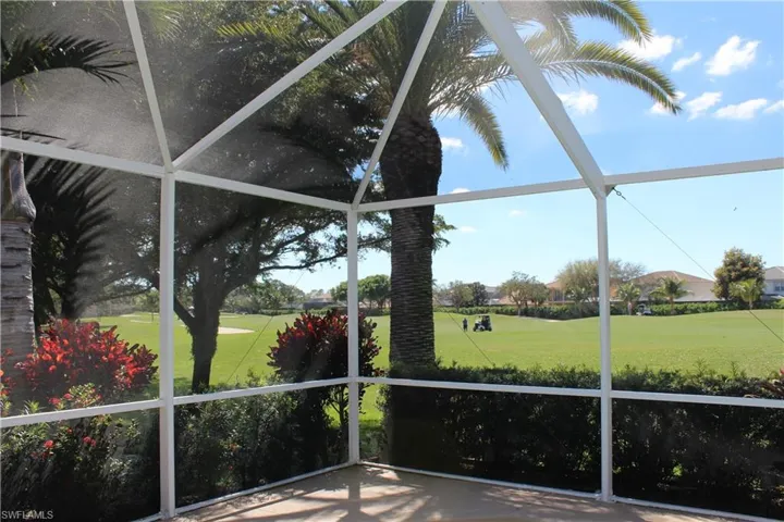 Unfurnished sunroom with golf course view