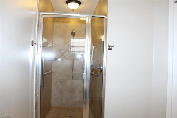 Master bath featuring a stall shower