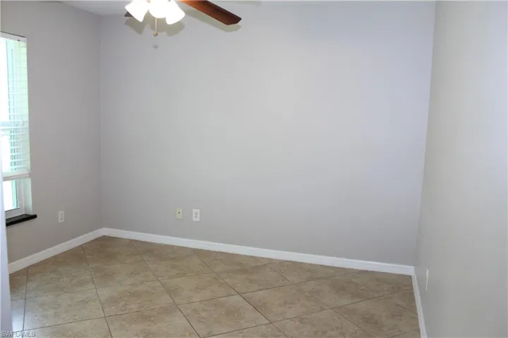 Guest Bedroom 3 featuring a ceiling fan and light tile patterned floors