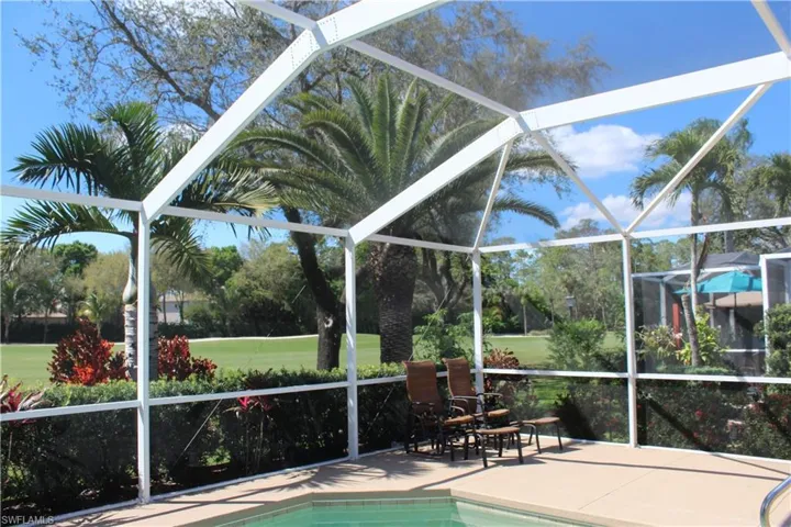 Pool with a lanai and a patio