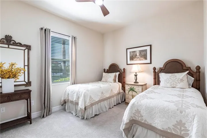 Bedroom #2 with ceiling fan and twin beds.
