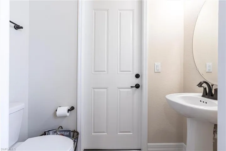1/2 bath that leads to the third bedroom and lanai