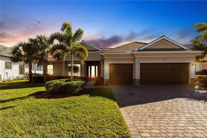 Front of home, 3 car garage, decorative stone accents