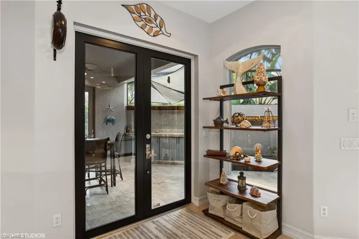 Entryway featuring hardwood / wood-style floors and french doors