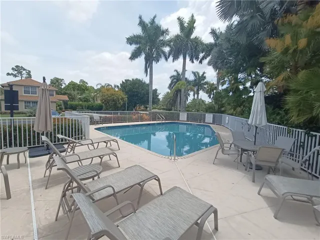 View of Chase Perverse community pool featuring a patio area