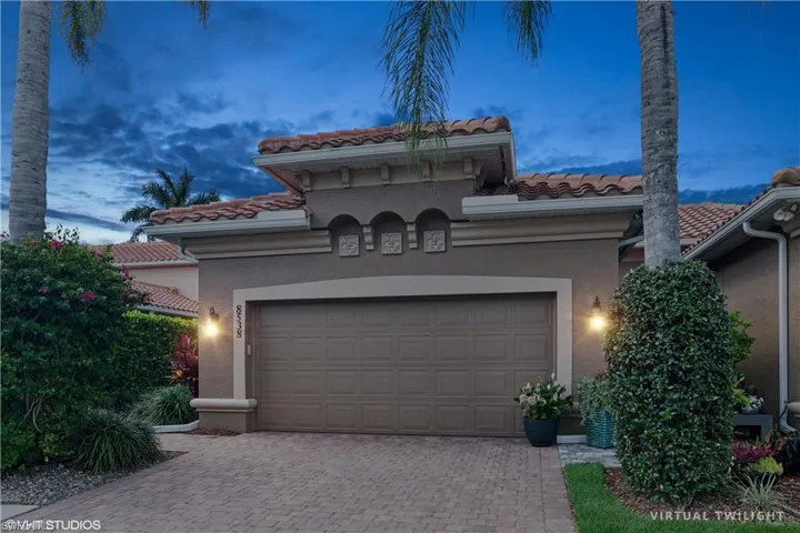 Mediterranean / spanish home with a garage
