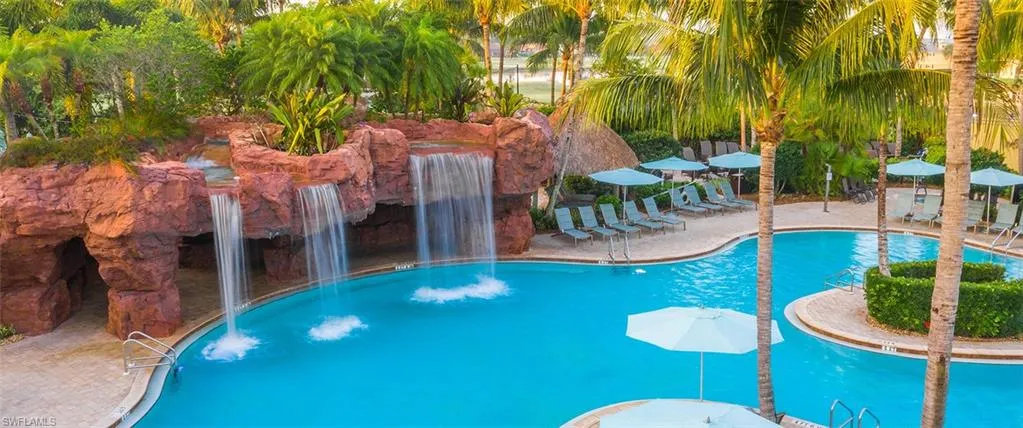 View of Players Club swimming pool featuring pool water feature