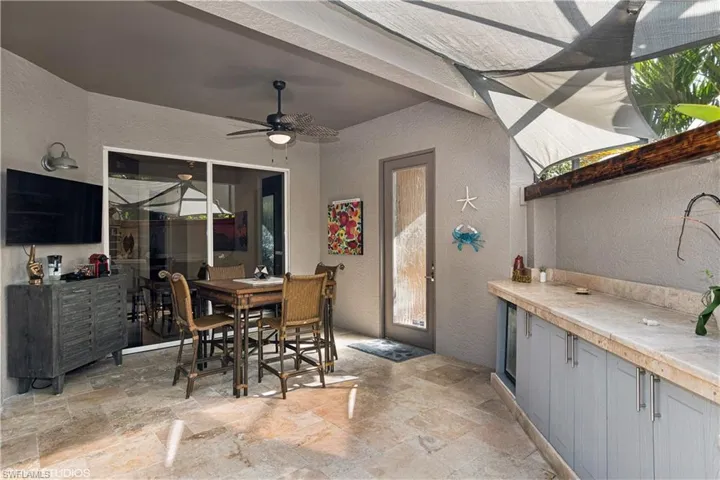 Tiled dining area with ceiling fan