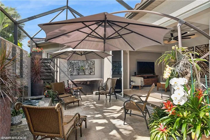 View of patio / terrace featuring glass enclosure and an outdoor hangout area
