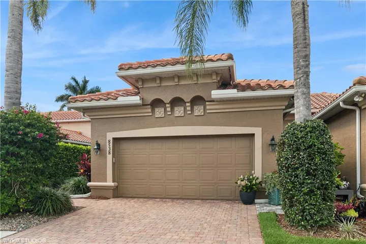 Mediterranean / spanish-style home featuring a garage