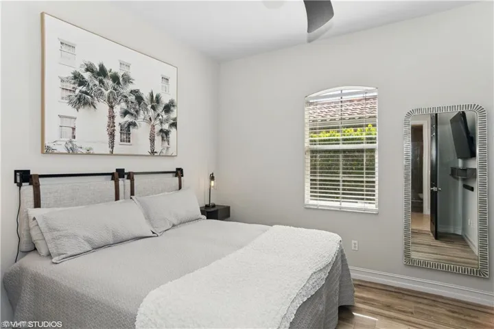 Bedroom featuring hardwood / wood-style floors and ceiling fan