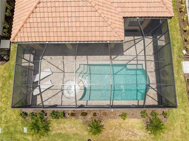 View of subject property with a pool