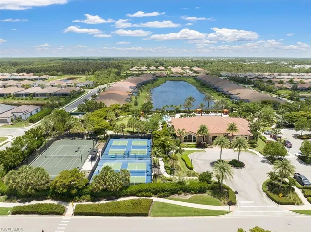Aerial view of residential area featuring a large body of water