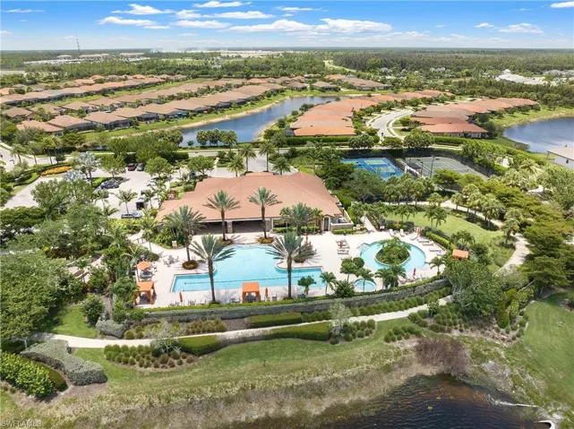 Aerial perspective of suburban area with a nearby body of water