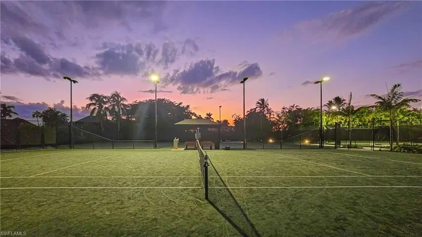 View of tennis court featuring a gazebo