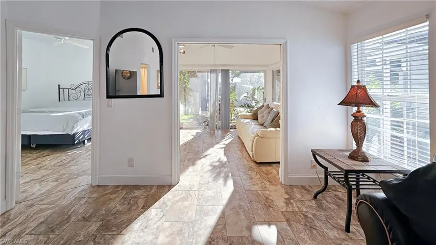 Living room with plenty of natural light and ceiling fan