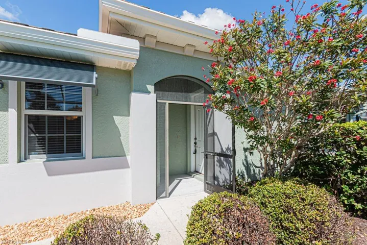 Doorway to property with stucco siding