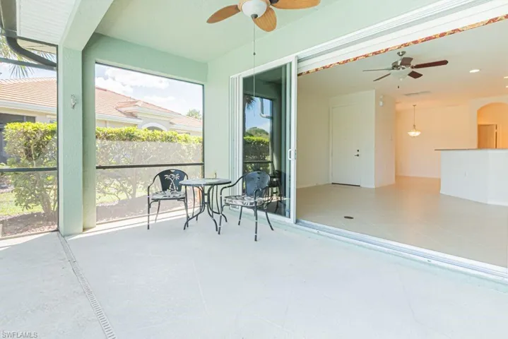 Sunroom featuring a ceiling fan