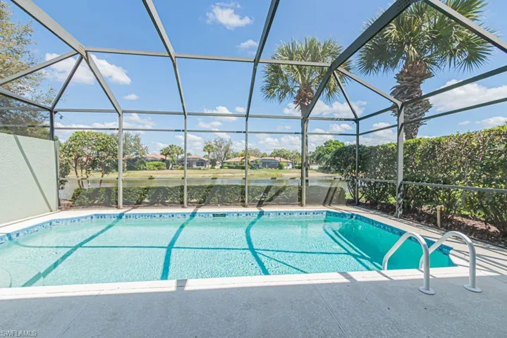 Outdoor pool  lanai, a water view, and a residential view