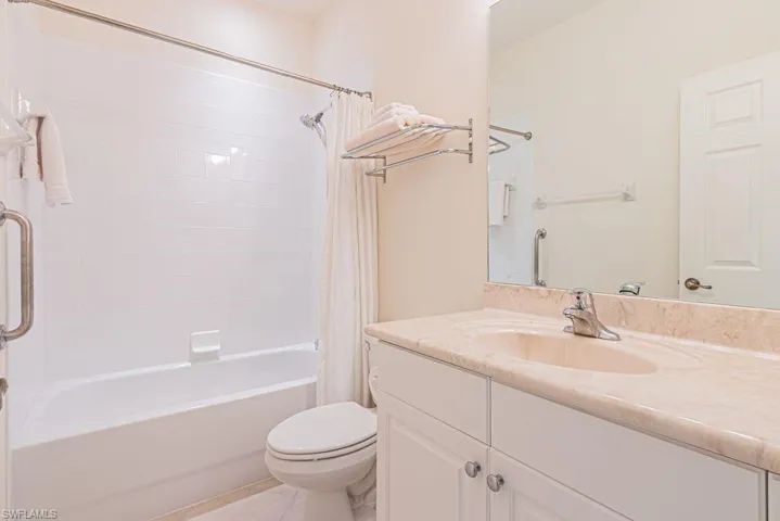 Full bathroom with vanity and shower / bath combo