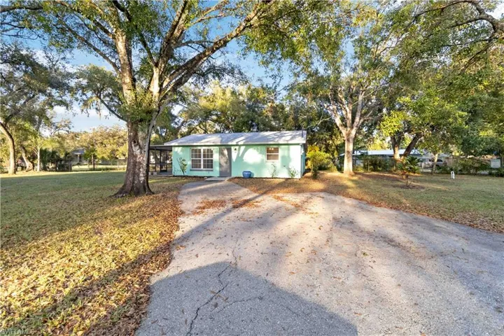 Ranch-style home with a front lawn