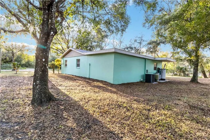 View of property exterior with central AC