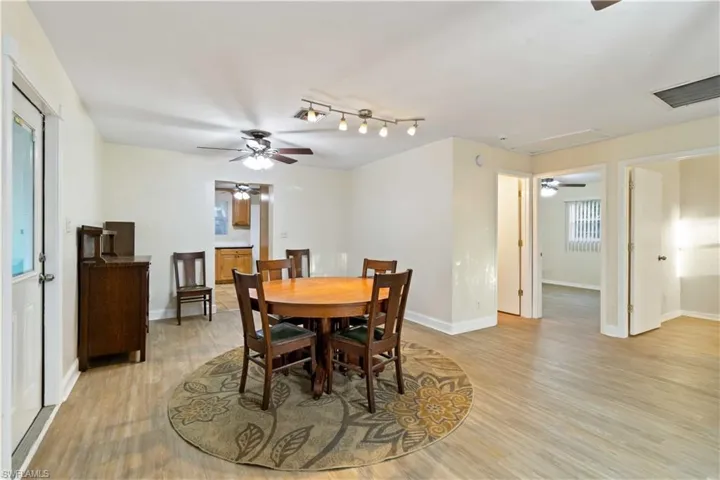 Dining room with ceiling fan and light hardwood / wood-style flooring