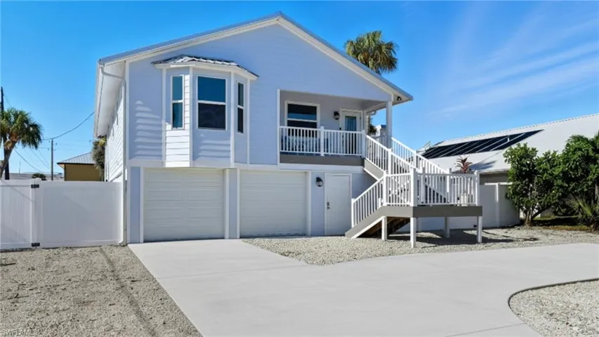 Charming elevated coastal home with a double garage - Virtually Edited Image