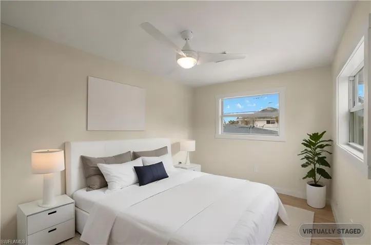 VIRTUALLY STAGED Well-appointed bedroom offering a peaceful sanctuary - Virtually Edited Image