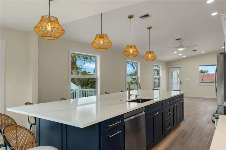 Spacious kitchen island, perfect for entertaining and casual dining - Virtually Edited Image