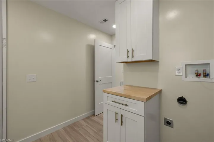 Functional laundry space with ample storage - Virtually Edited Image