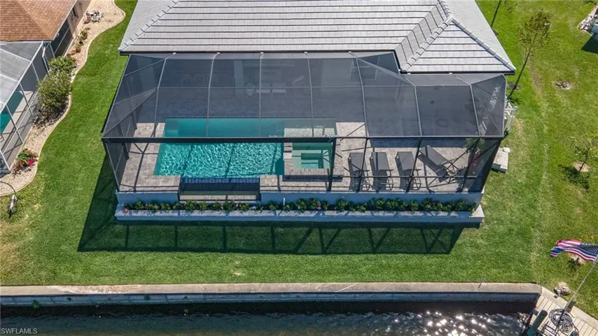 View of subject property with a pool