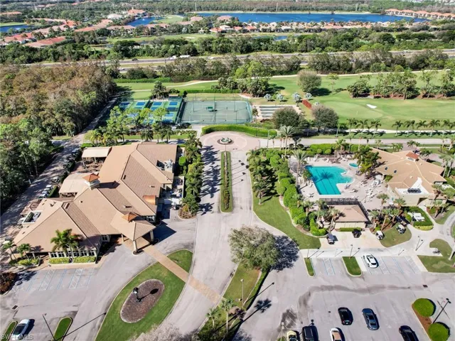 Drone / aerial view with a water view and golf course view