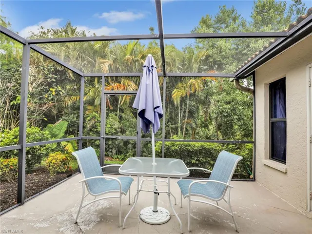 Sunroom with a wealth of natural light and outdoor dining space