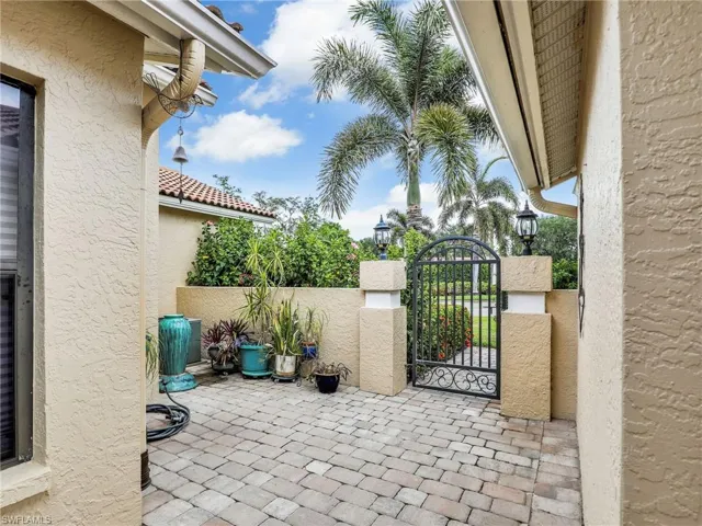 View of patio featuring a gate and fence