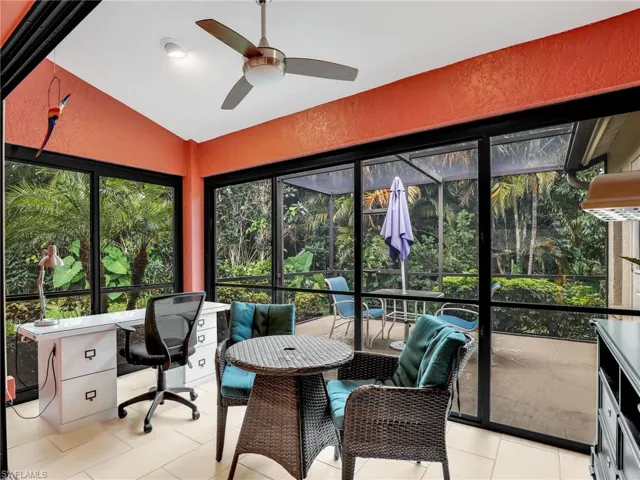 Sunroom featuring a ceiling fan