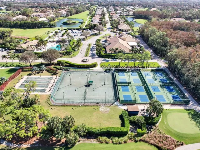 Drone / aerial view featuring a residential view, a water view, and golf course view
