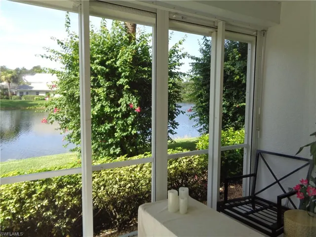 Sunroom / solarium with a water view