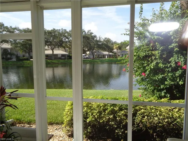 Sunroom with a water view