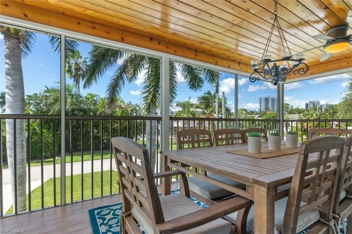 Sunroom featuring a chandelier