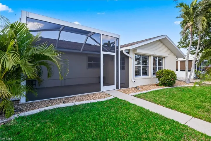 Covered outdoor space ideal for entertaining, dining al fresco, or enjoying tranquil waterfront sunsets.