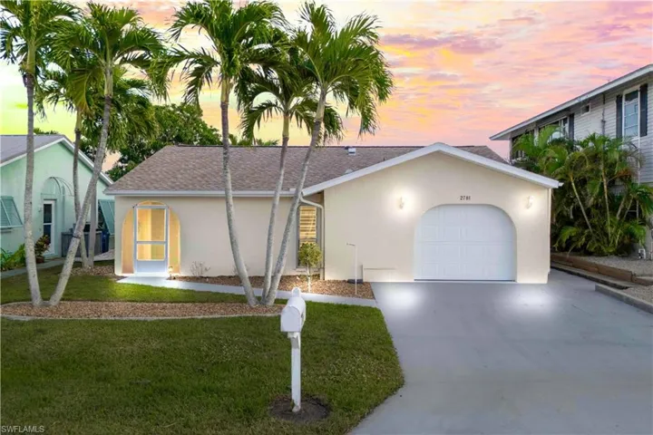 The most charming home with gorgeous lawn and mature landscaping, complimented by curbing and plenty of parking!