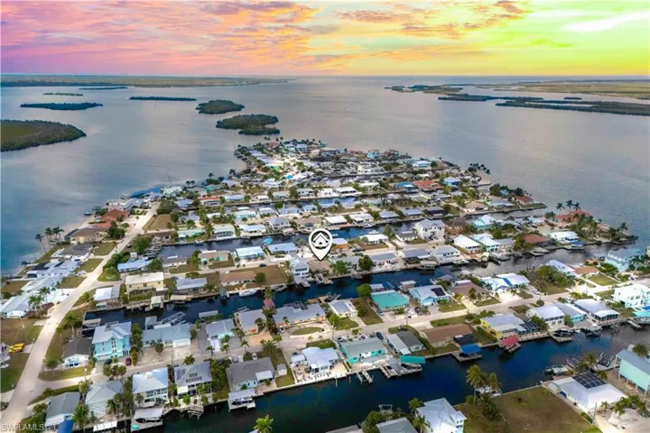 Breathtaking aerial view of the home at sunset, a magical location and a fully renovated home with no detail spared!