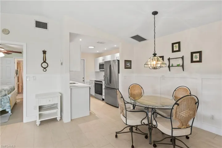 Well-placed dining area allows easy movement between cooking, entertaining, and relaxing in the primary bedroom.