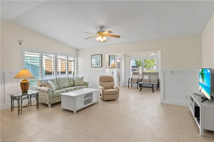Open and bright with large windows, creating a seamless connection between indoor and outdoor living. Spacious layout for seating and entertaining.