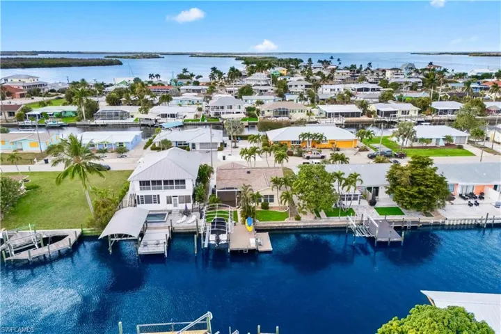 Waterfront Living at Its Best!  This home checks all the boxes - an amazing home and a boatlift and additional dockage!