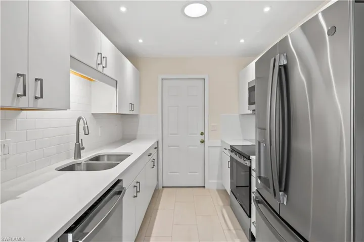 Well-appointed kitchen featuring sleek stainless-steel appliances, ample cabinetry, and plenty of counter space for cooking and entertaining.