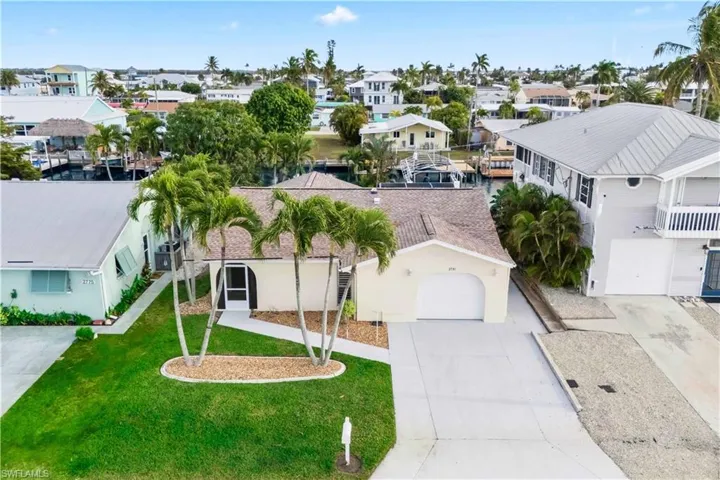 The featured home sits directly on the open canal, offering quick and direct access to the Gulf of Mexico.