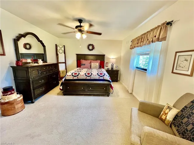 Primary bedroom with ensuite private bathroom with large walk in closet with build in shelving.